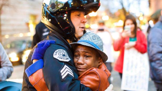 Please Don’t Show me the Picture of the Boy Hugging the Police Officer